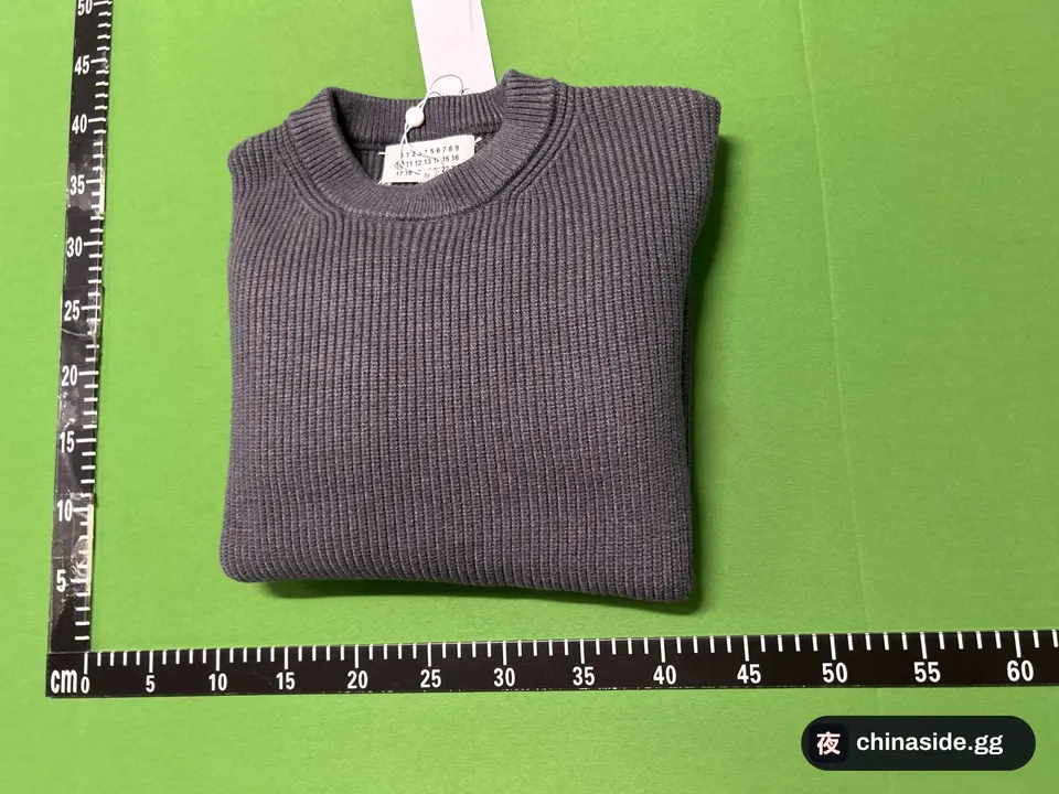 QC photo of the Four-Corner Stitch Logo Sweater